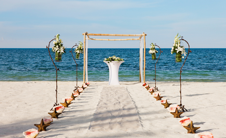 Beach wedding setup at the Beloved Hotel